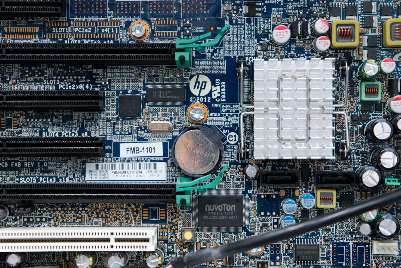 Detailed view of a complex HP motherboard packed with components, great for explaining circuit design and computer hardware basics.